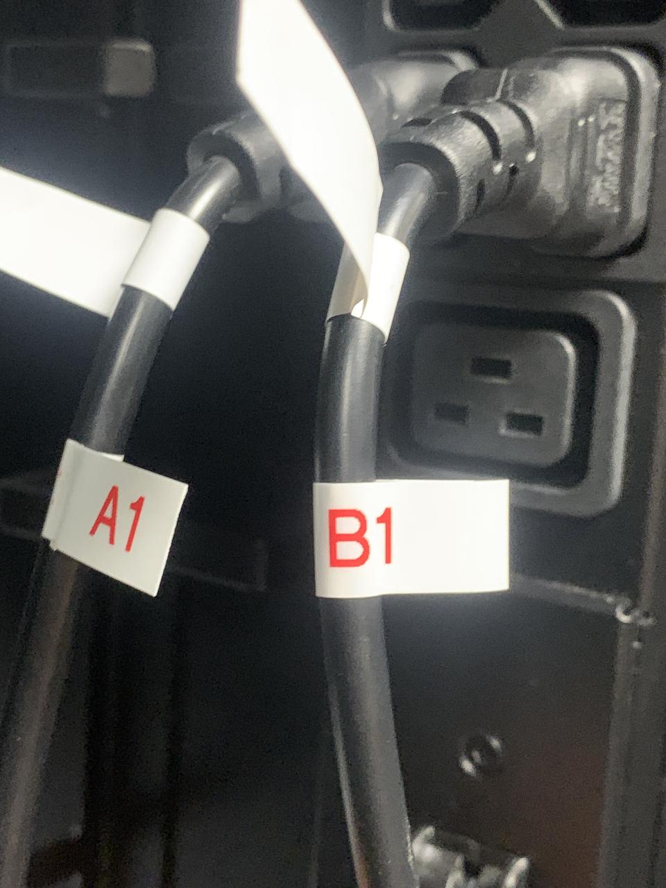 Two black power cables labelled A1 and B1 plugged into a PDU