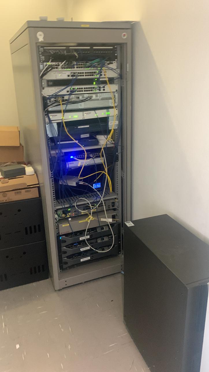 Floor-standing network cabinet installed in an office