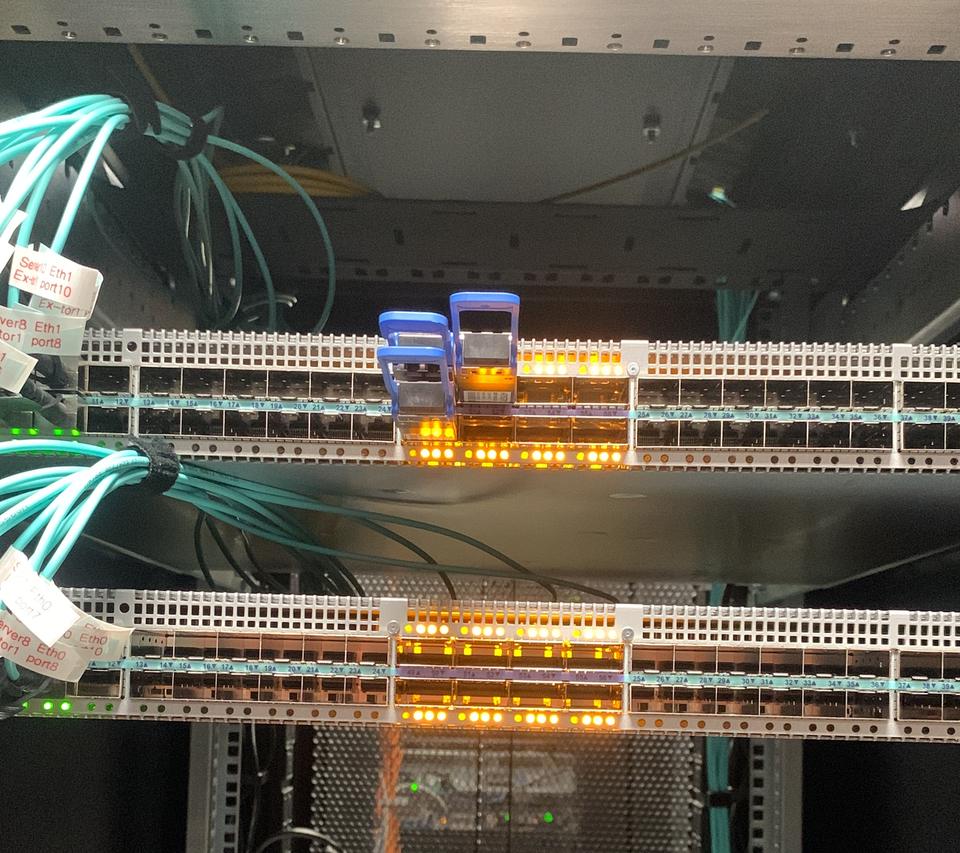 Rack switches with amber port lights and aqua fibre patching