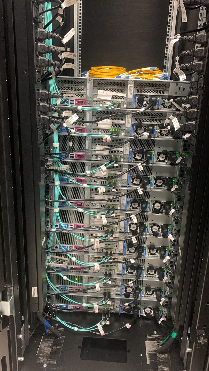 Rear of a server rack with dressed power and network cables